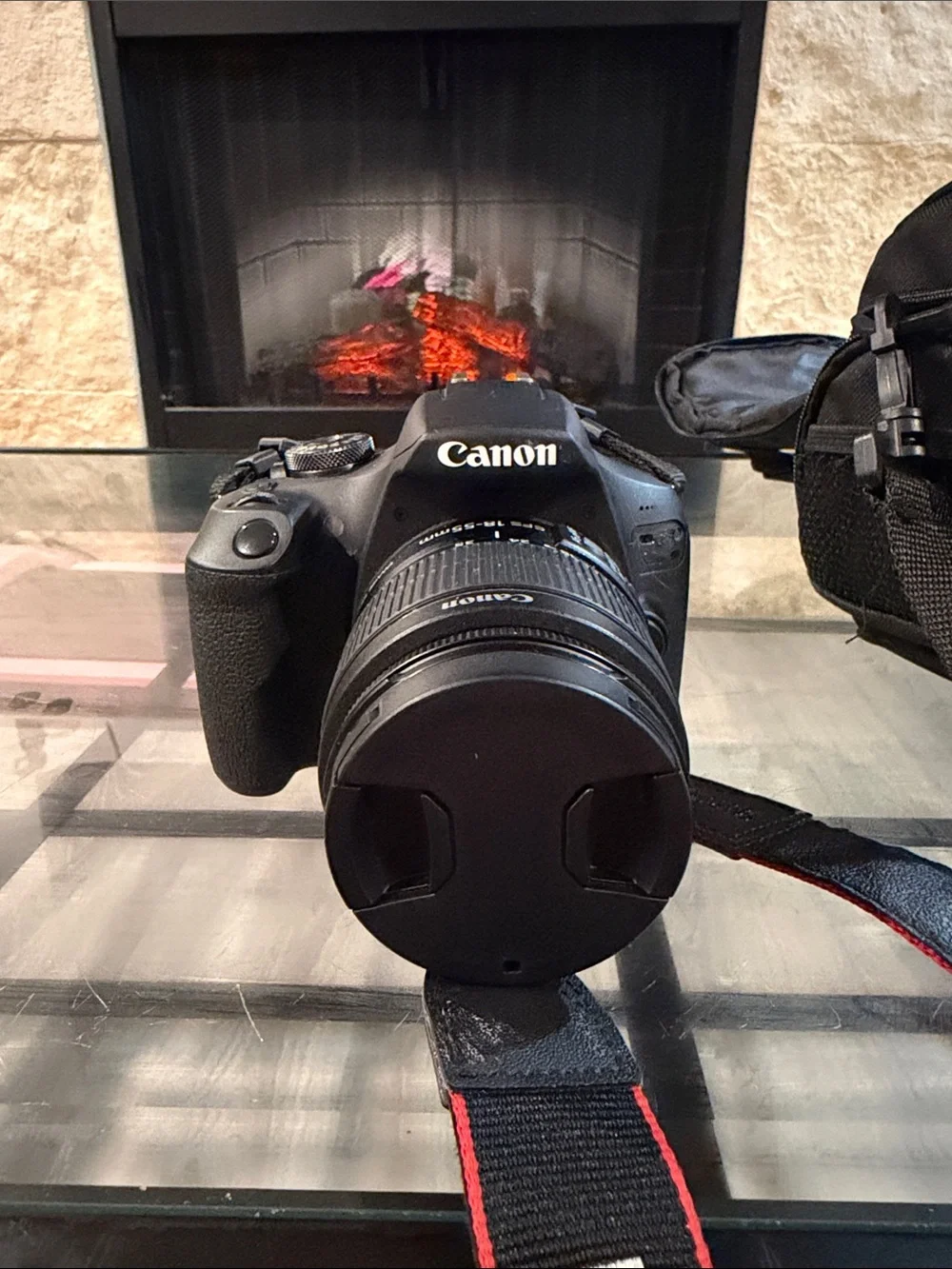 Canon Black DSLR Camera with Black Lens and Red-Trim Strap